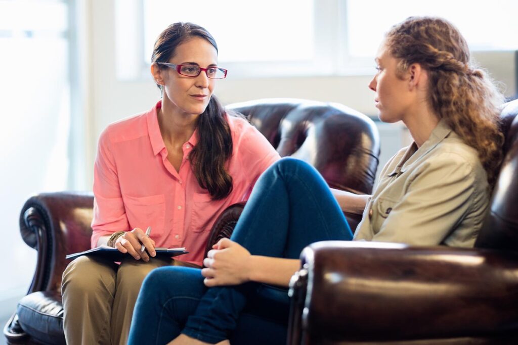female therapist meeting with patient to discuss how to talk about mood disorder symptoms