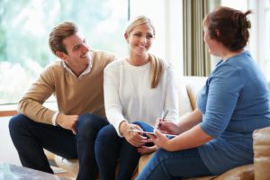 therapist explaining to couple why couples counseling is beneficial