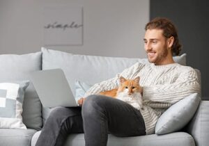 guy with cat on lap in outpatient program