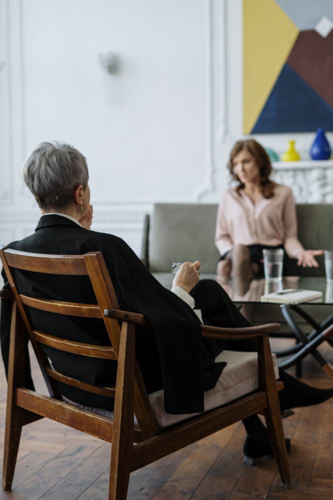 female psychiatrist meeting with a female client during a therapy session