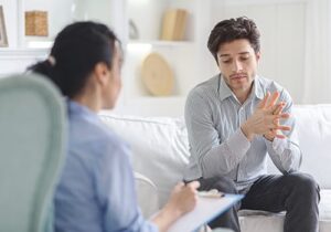 therapist discussing ADHD treatment options with a client