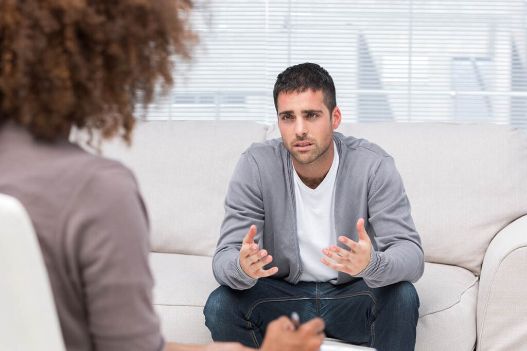 anxious man inquiring about anxiety treatment in arlington texas from behavioral health professional