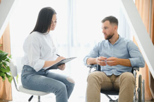 therapist explaining to male patient his options for mental health disorder treatment