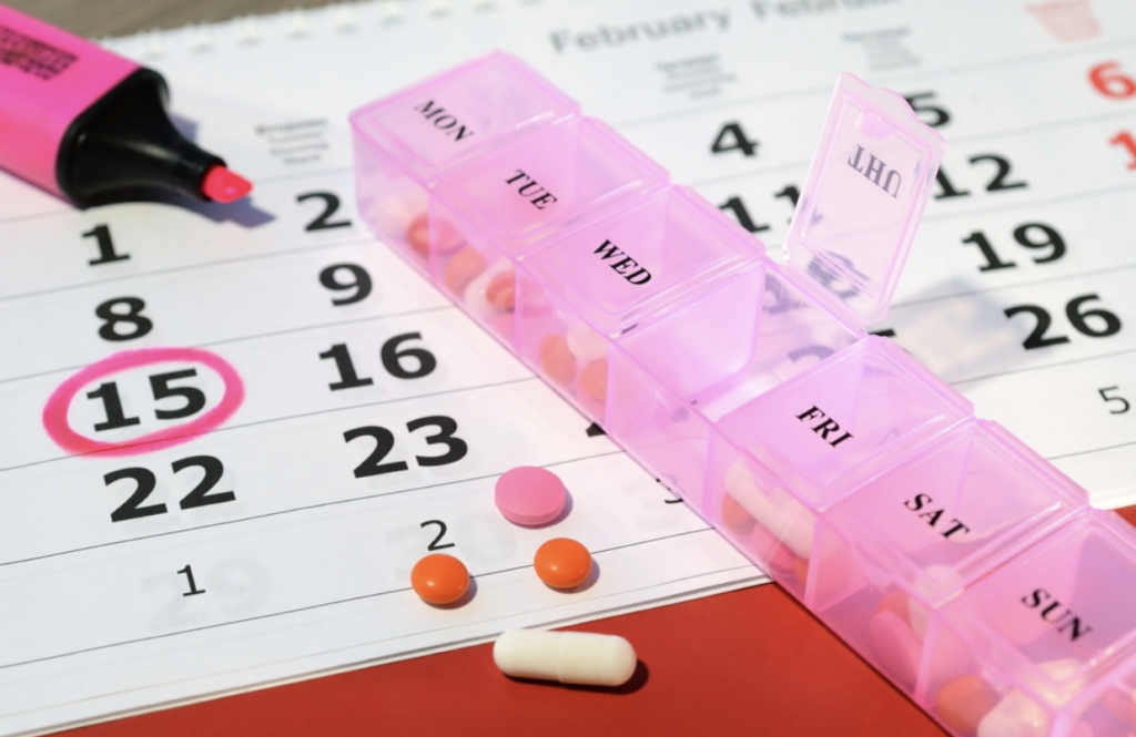 Medication management calendar and pill organizer 